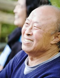 A mature man with a complete smile thanks to restorative dentistry in Englewood.