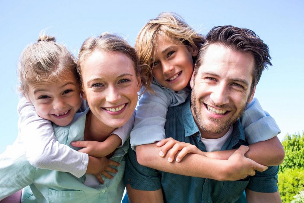 Family with children playing outside experienced expert general dentistry at Vitangeli Dental in Brookville, OH