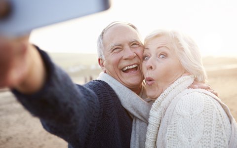 Older couple taking selfie