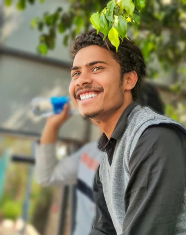 Smiling man shows off straight white teeth after smile design in Dayton Ohio