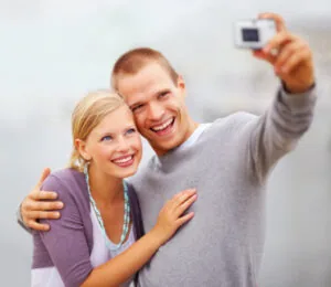 A young couple smiling after whitening treatments in Englewood.